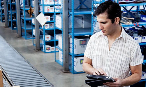technician maintaining a conveyor
