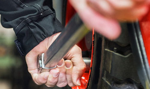 technician maintaining a forklift